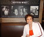 Signing a mural at The Row on May 26, 2016, that contains a photo of Jeannie Seely, Dottie West, and me in the recording studio